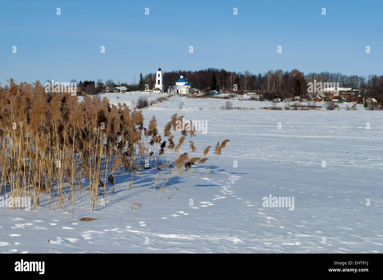 Winter rural landscape with frozen river Stock Photo