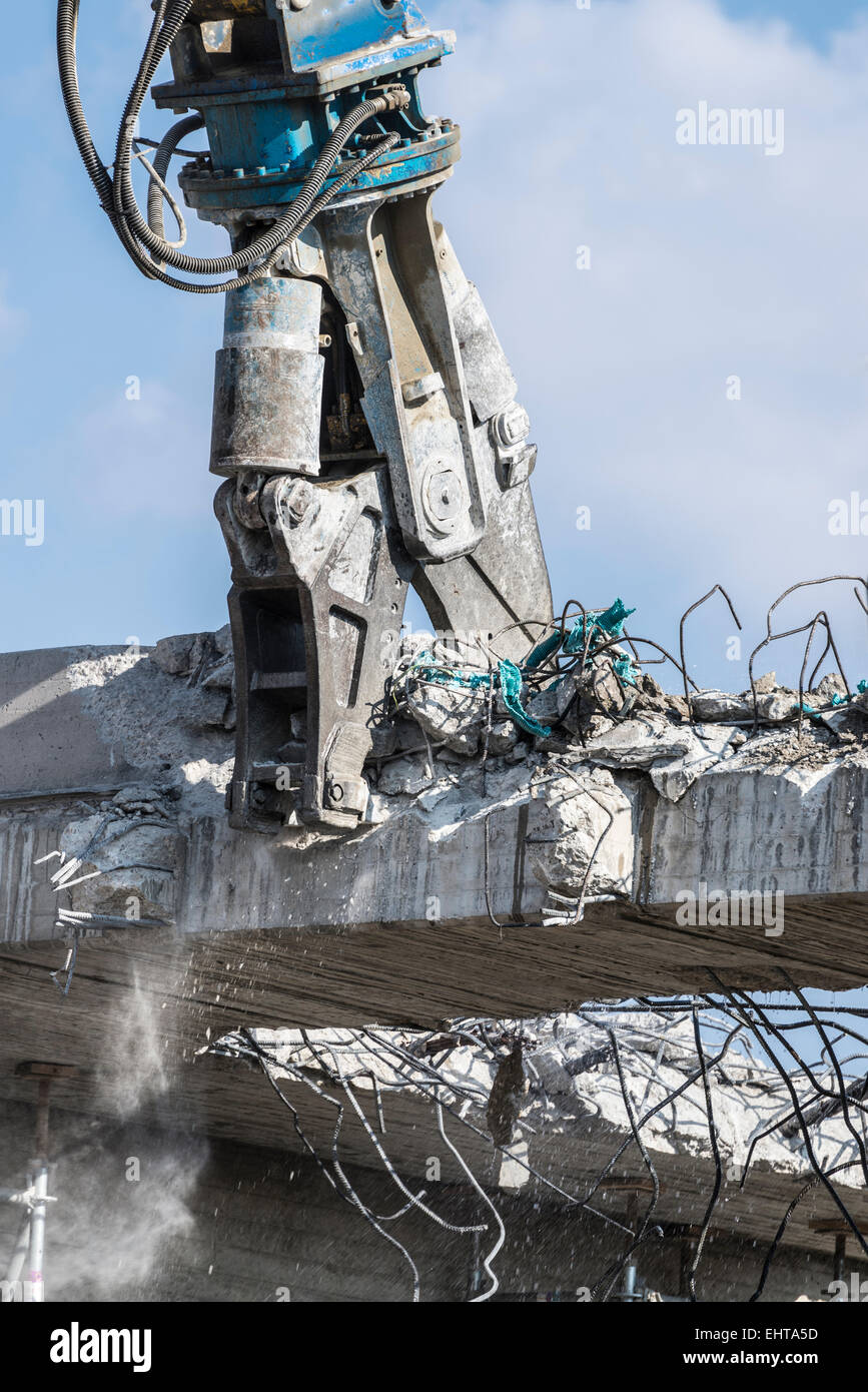 A crane breaking down a building Stock Photo Alamy