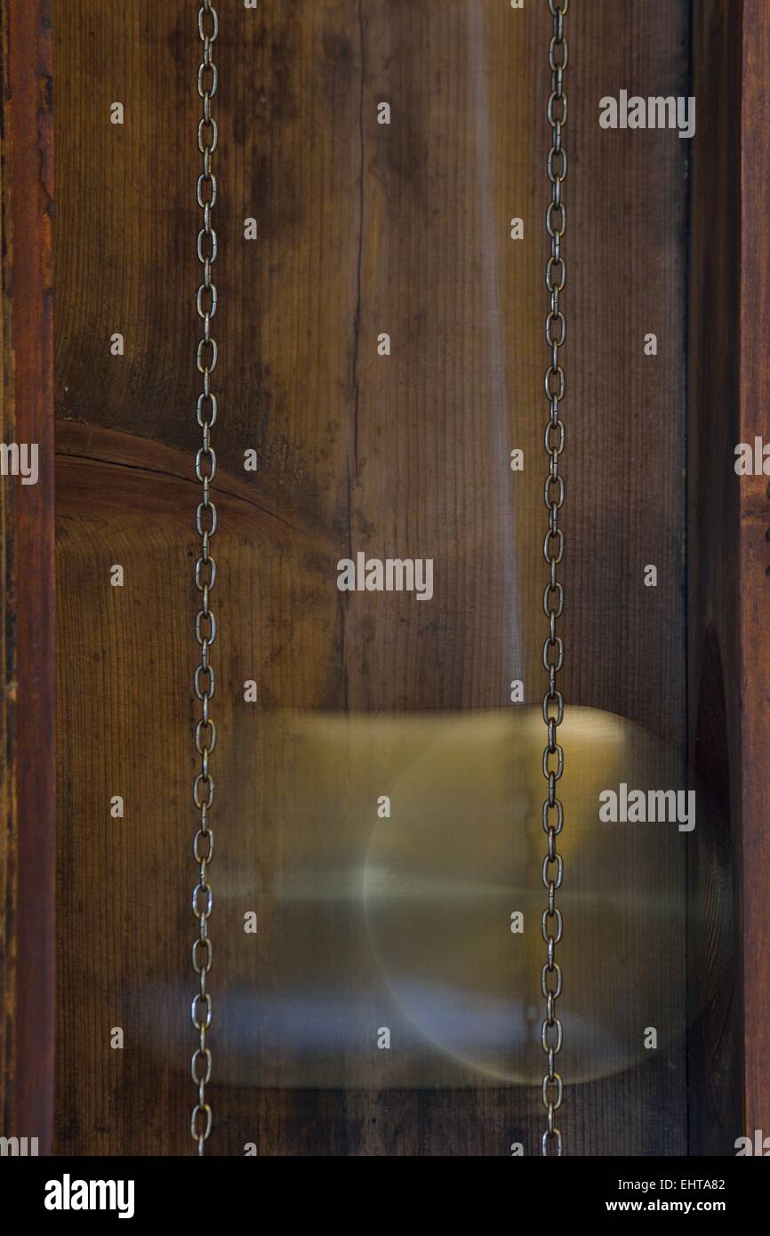 Pendulum of a grandfather clock Stock Photo Alamy