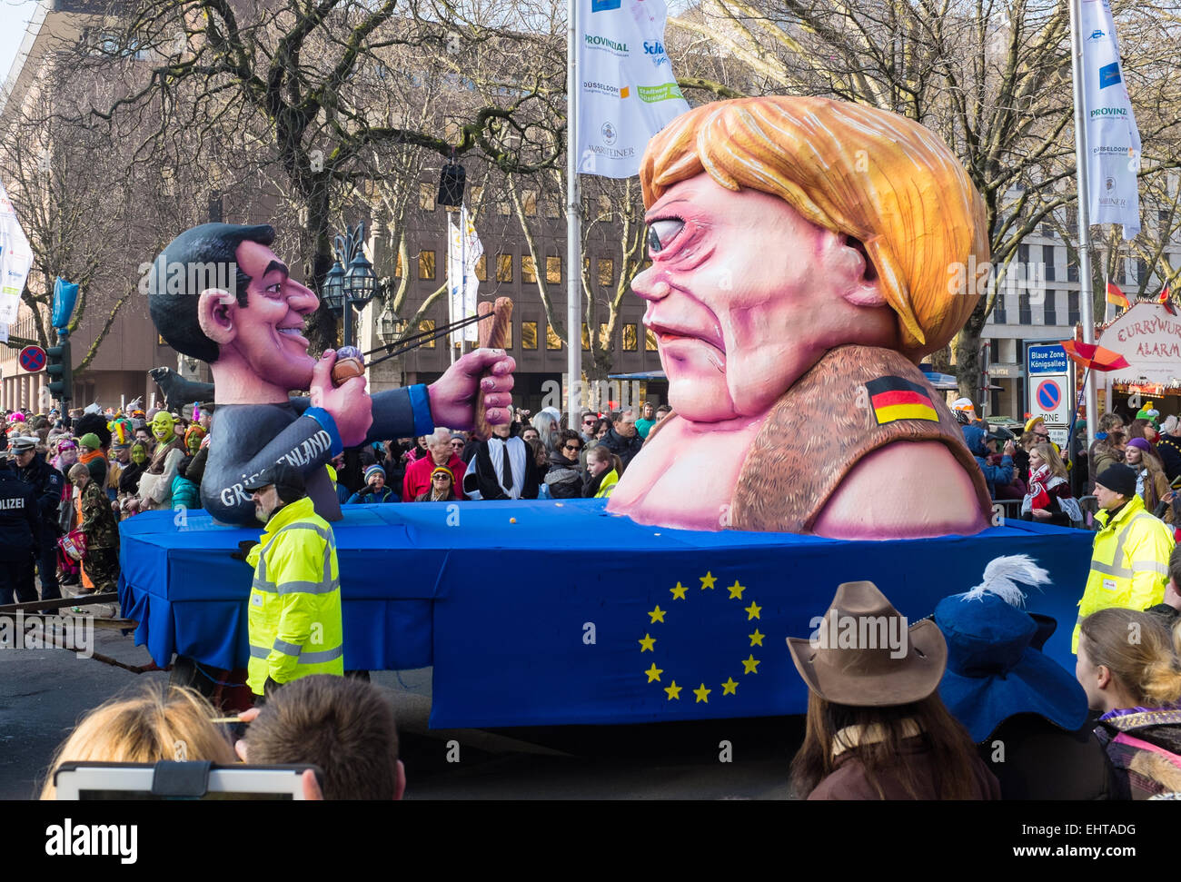 Alexis Tsipras Greek Prime ministers shoots Angela Merkel in the eye , Rosenmontag parade , Dusseldorf Germany Stock Photo