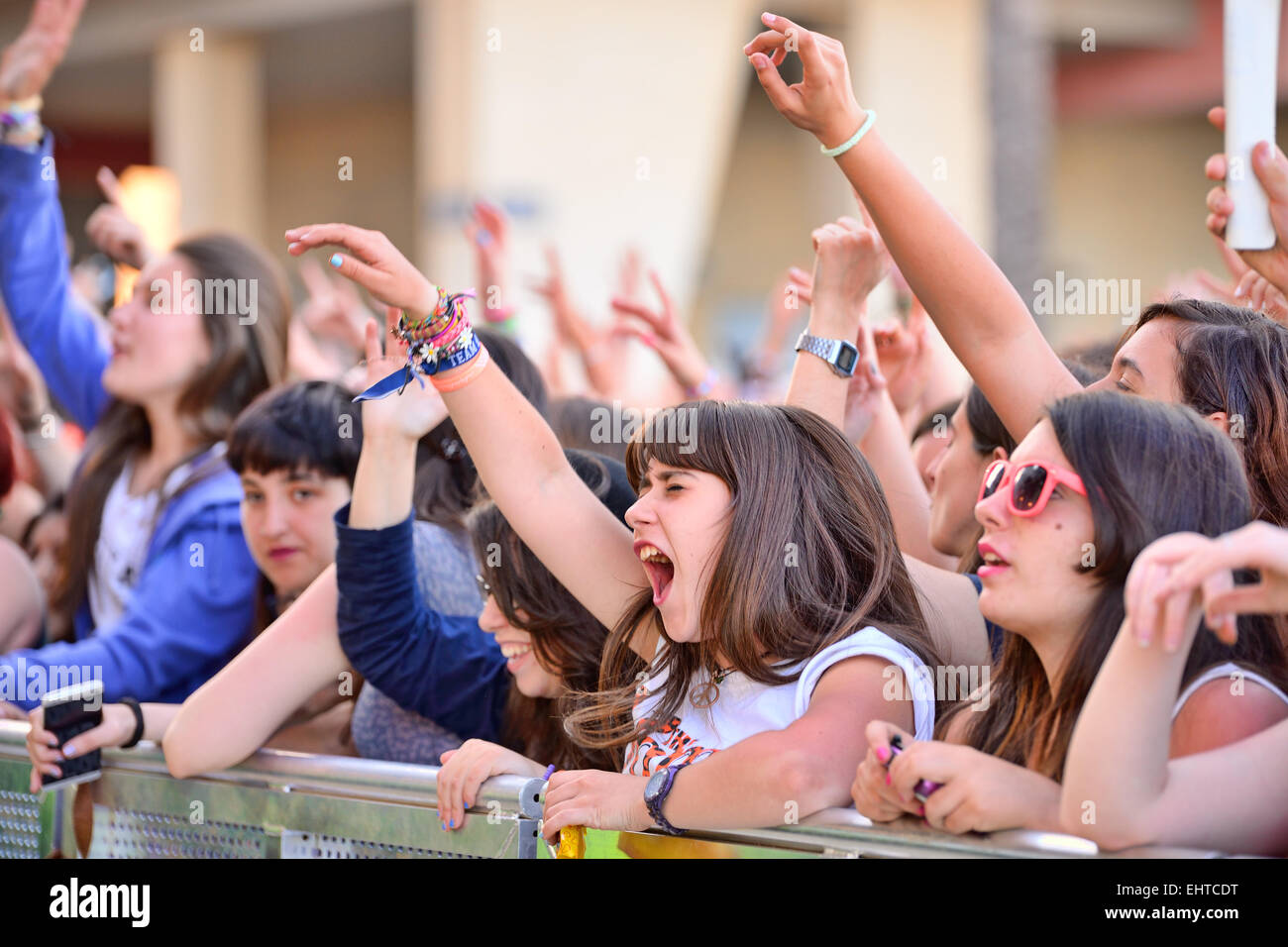 BARCELONA - MAY 23: Girls from the audience in front of the stage, cheering on their idols at the Primavera Pop. Stock Photo