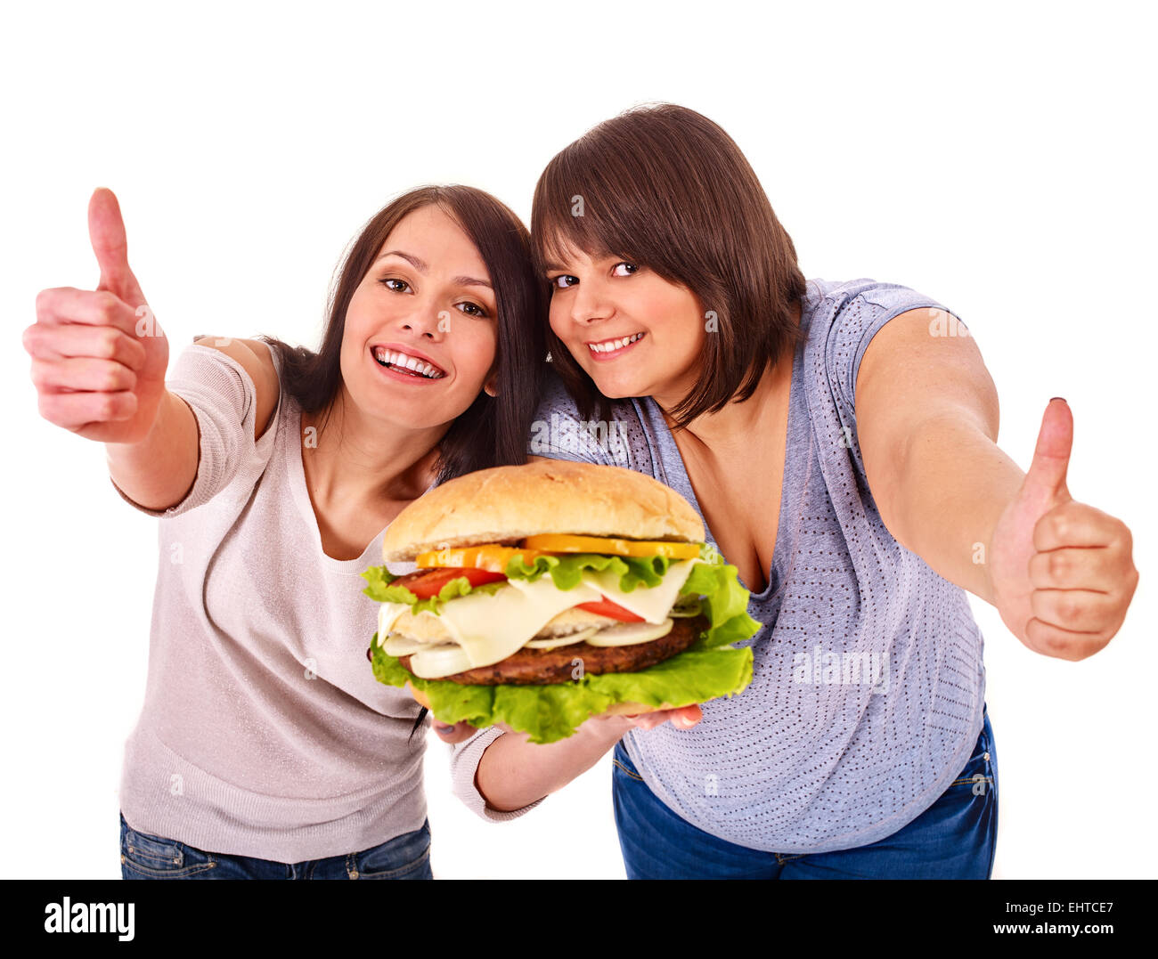 Women eating hamburger. Stock Photo