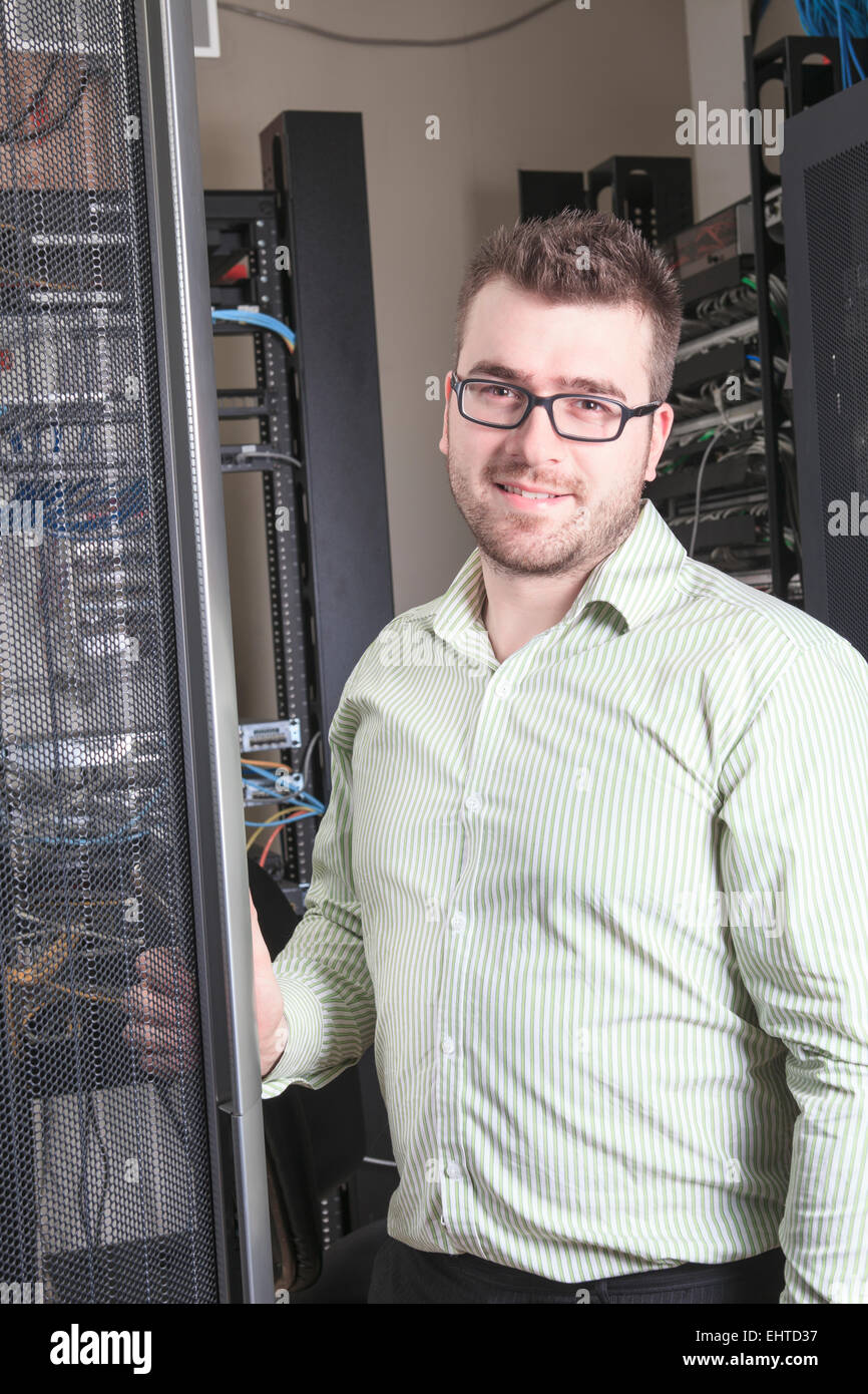 Network engineer working in server room Stock Photo Alamy