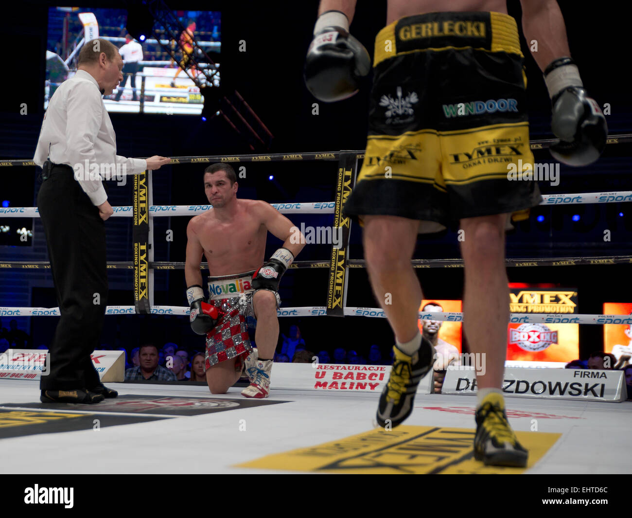 LUBIN, POLAND - MARCH 14, 2015: Professional boxing fight between Michal Gerlecki (black short) and Stjepan Bozic  (gray short). Stock Photo