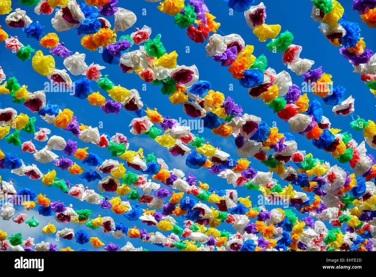 Colorful paper decoration garland on a market place Stock Photo