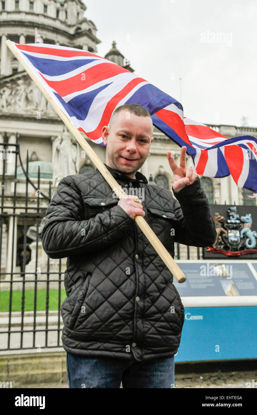 Belfast, Northern Ireland. 17 March 2015 - Thomas Maxwell waves a union flag as loyalists start a 24 hour vigil to have the flag flown 365 days during St. Patrick's Day Credit:  Stephen Barnes/Alamy Live News Stock Photo