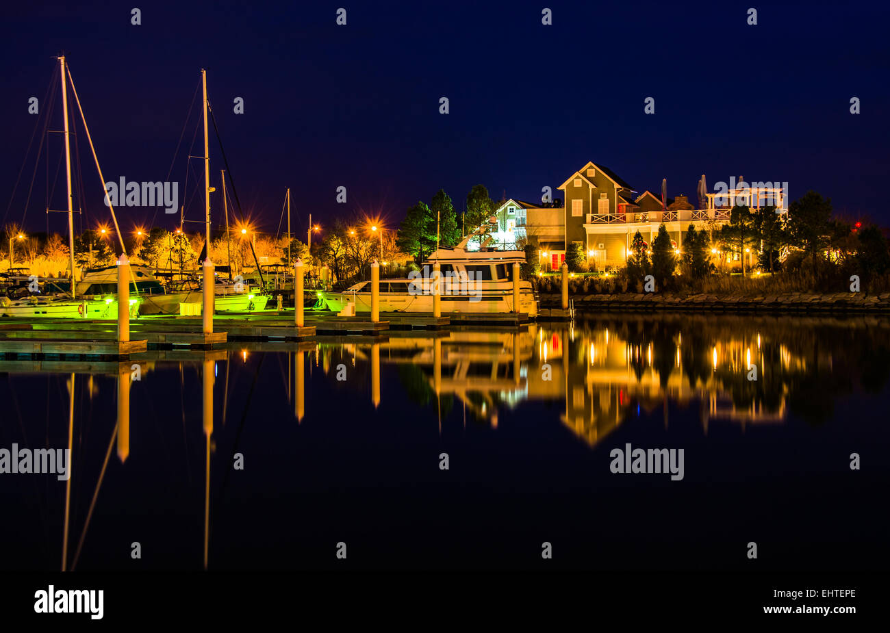 Boats reflecting at night at the Bay Bridge Marina in Kent Island