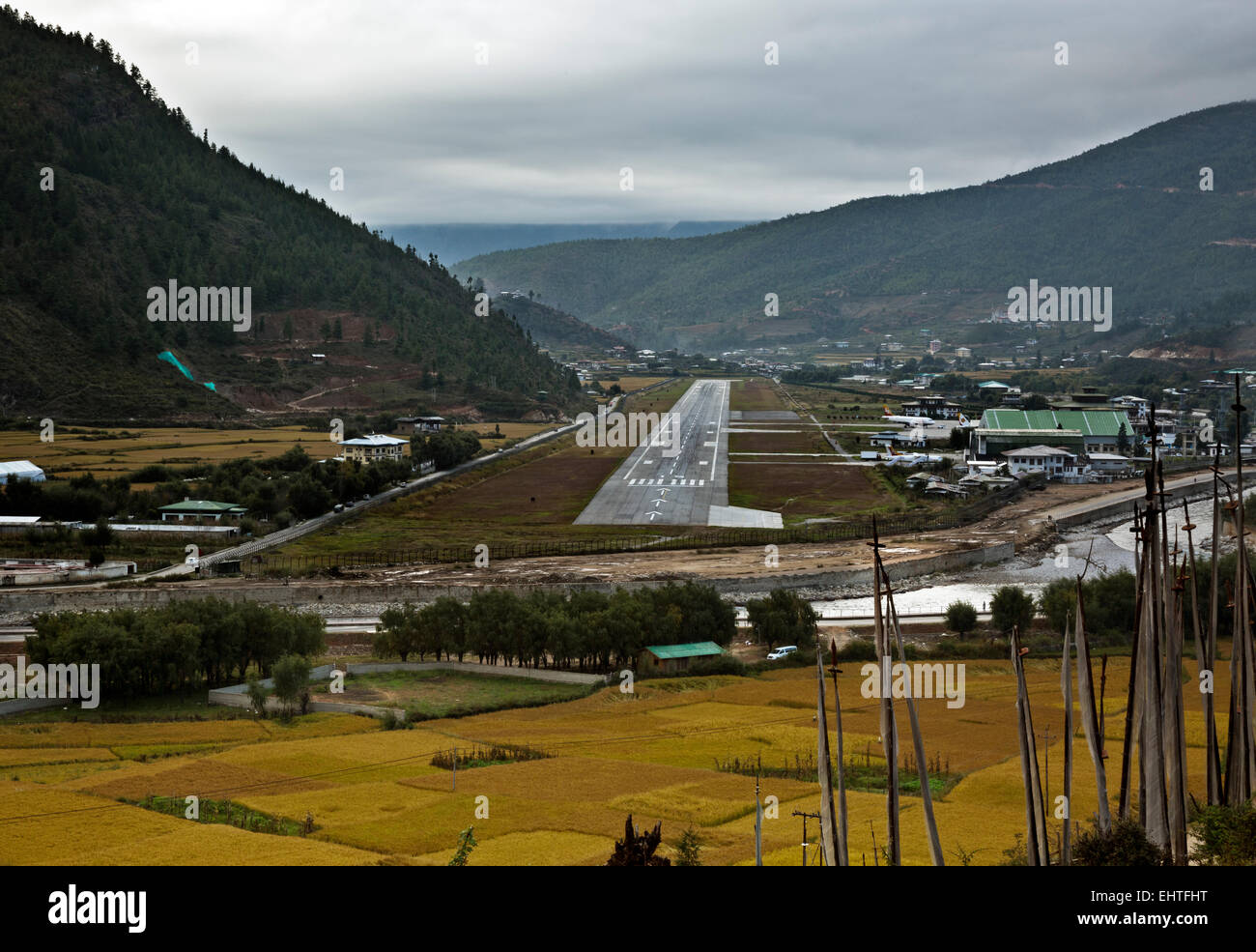 BU00381-00...BHUTAN - The Paro International Airport and the Paro Chhu (River), surrounded by grain fields. Stock Photo