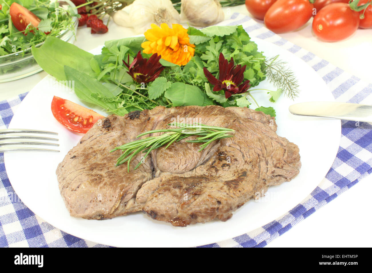 ribeye steak with wild herb salad Stock Photo