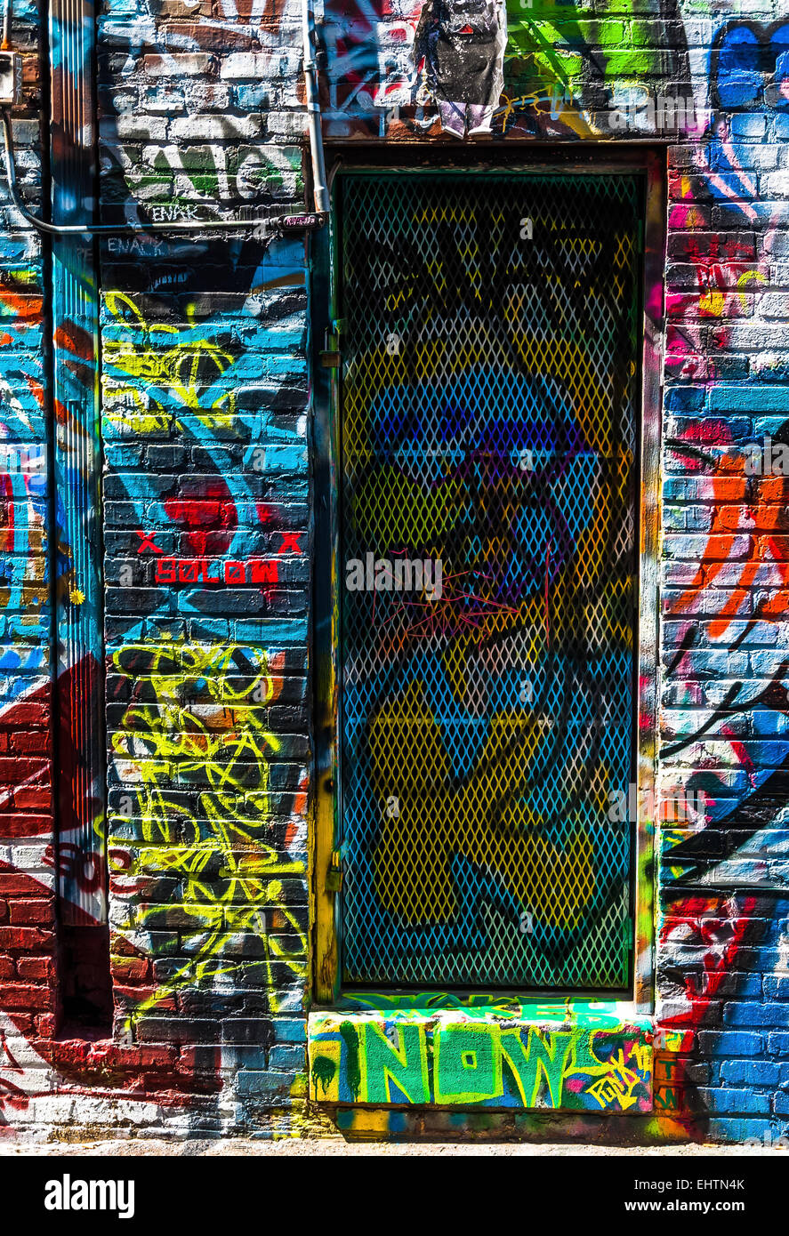Graffiti on walls and door in Graffiti Alley, Baltimore, Maryland Stock