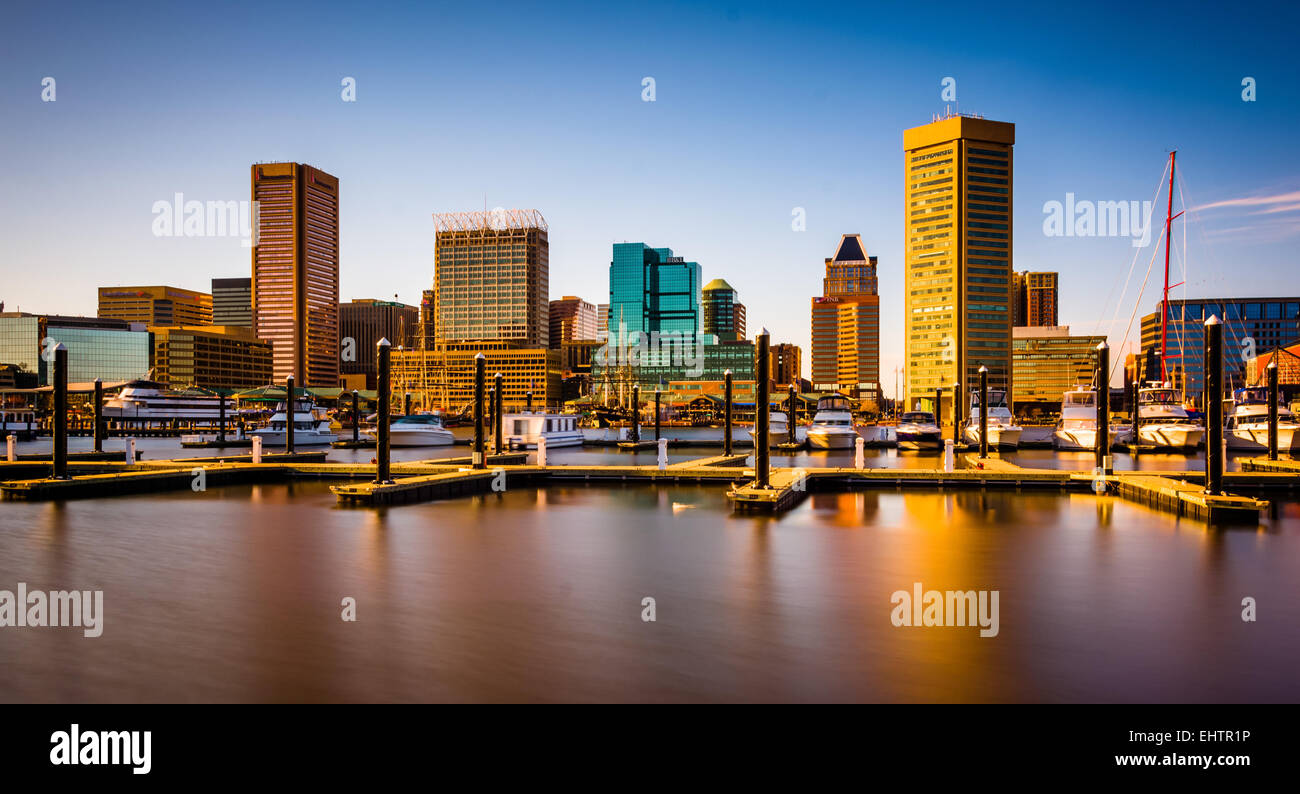 Long exposure of docks and the skyline at the Inner Harbor in Baltimore ...