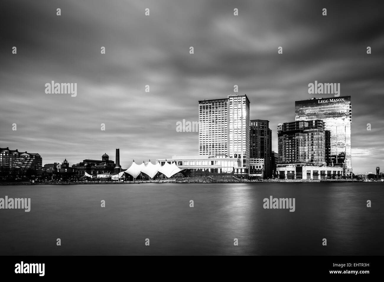 Long exposure of skyscrapers in Harbor East, seen from the Inner Harbor, in Baltimore, Maryland. Stock Photo