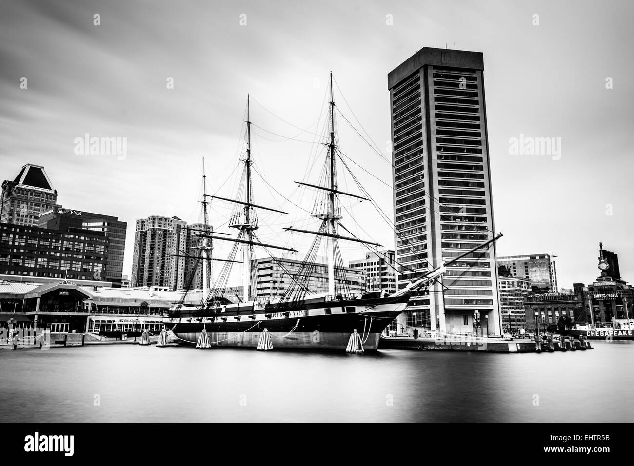Long exposure of the USS Constellation and World Trade Center, in Baltimore, Maryland. Stock Photo