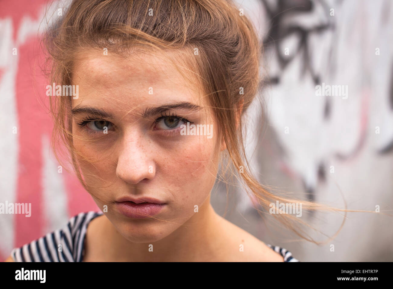 Close-up portrait outdoors of young girl with expressive eyes. Stock Photo