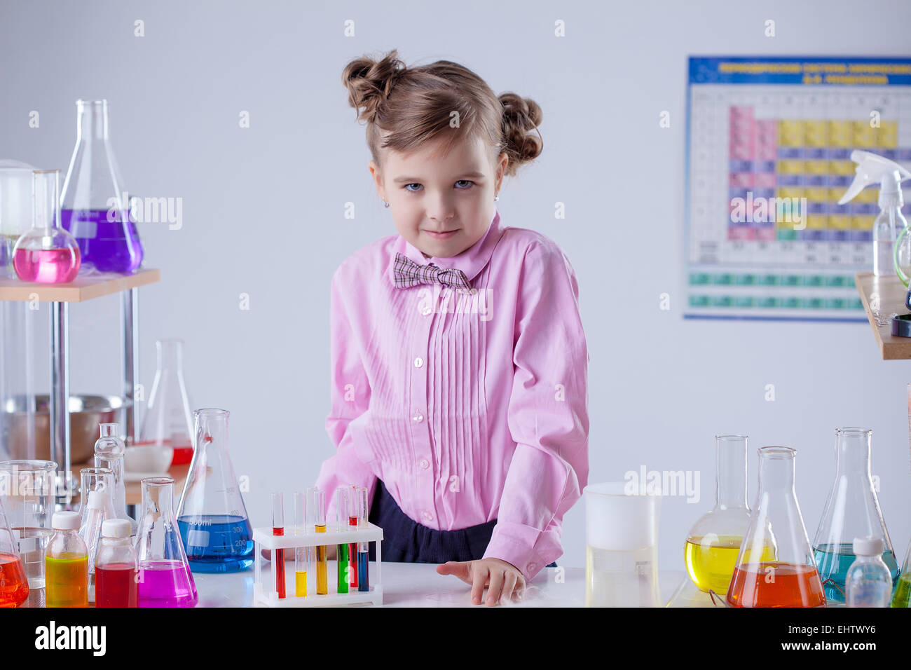 Serious little laboratorian looking at camera Stock Photo