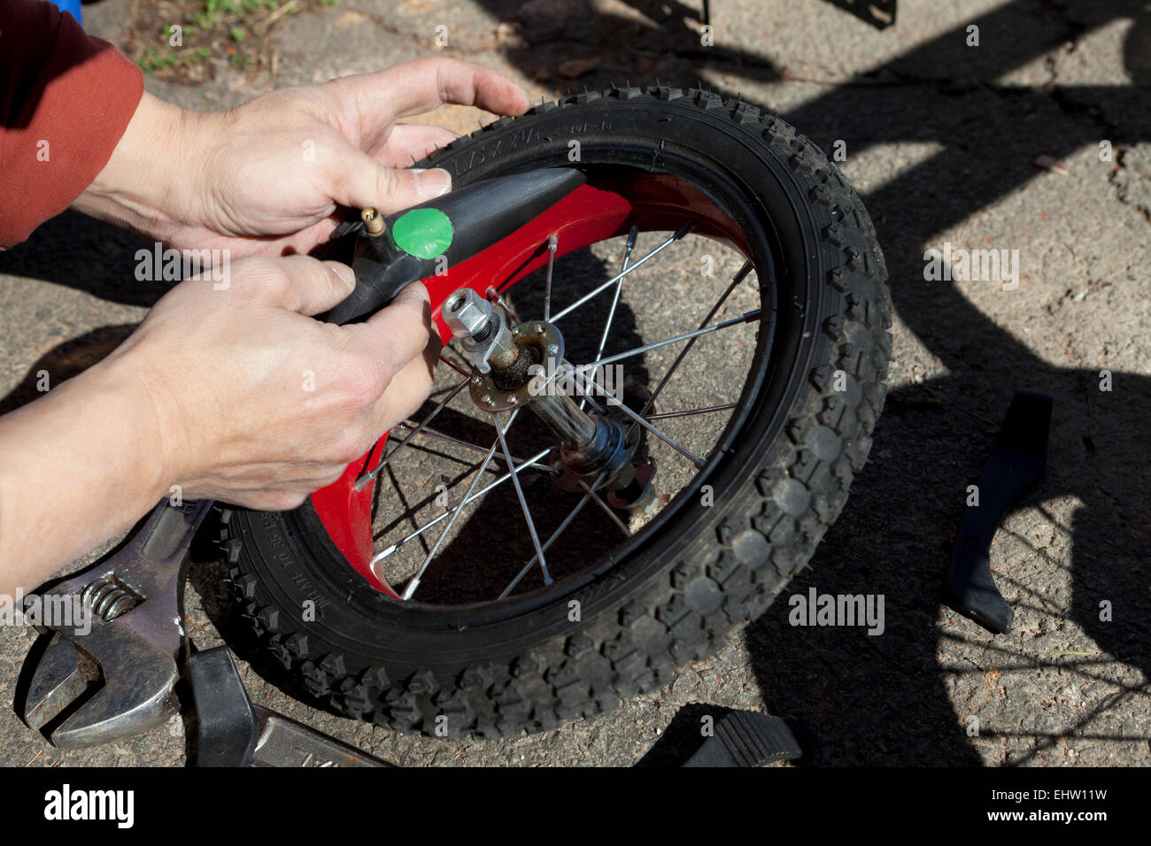 Man patching child's bicycle tire USA Stock Photo Alamy