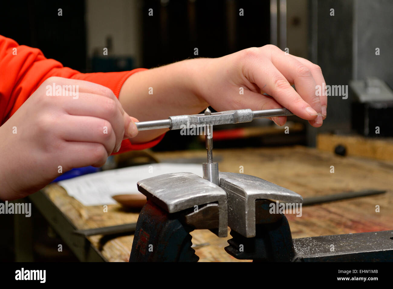 Person works with thread trimmer Stock Photo