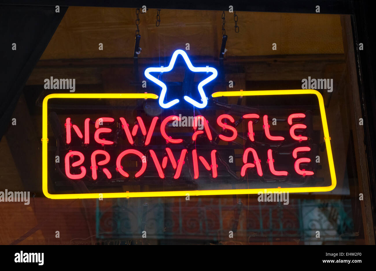 A neon sign advertising Newcastle Brown Ale in a pub window Stock Photo