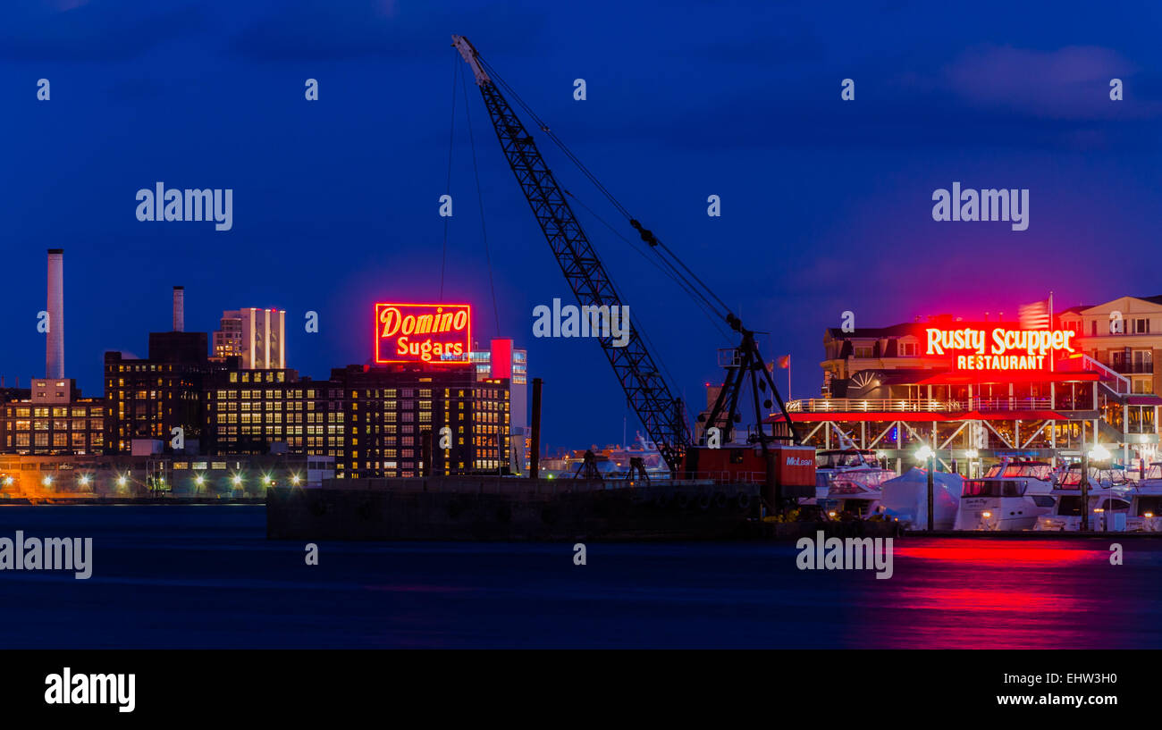 BALTIMORE - FEBRUARY 25: The Domino Sugars Factory at night on February 25th, 2012 in Baltimore, Maryland. This factory is an im Stock Photo