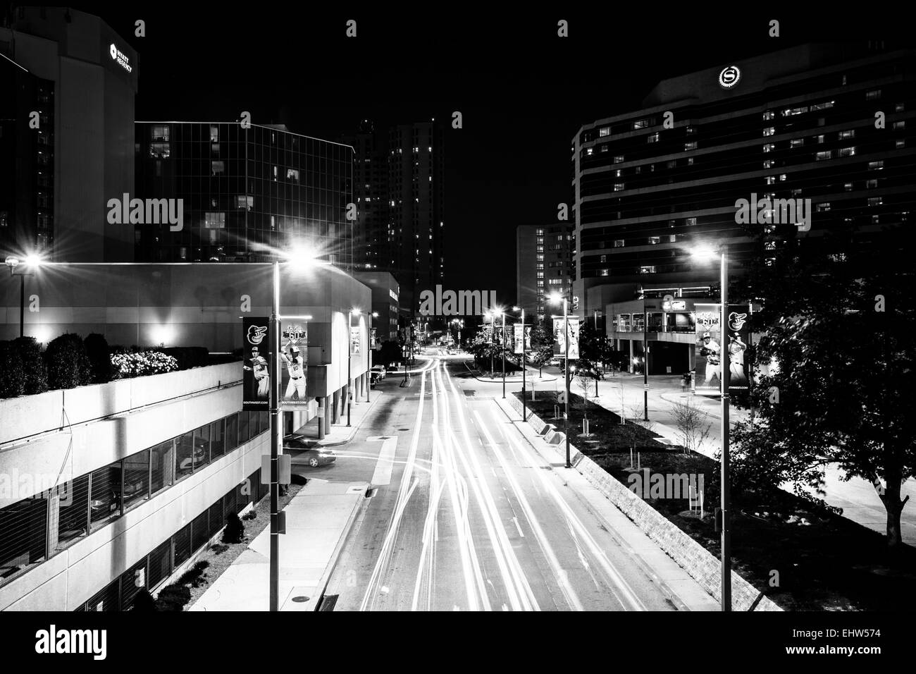 Traffic and buildings on Charles Street  at night, in the Inner Harbor, Baltimore, Maryland. Stock Photo