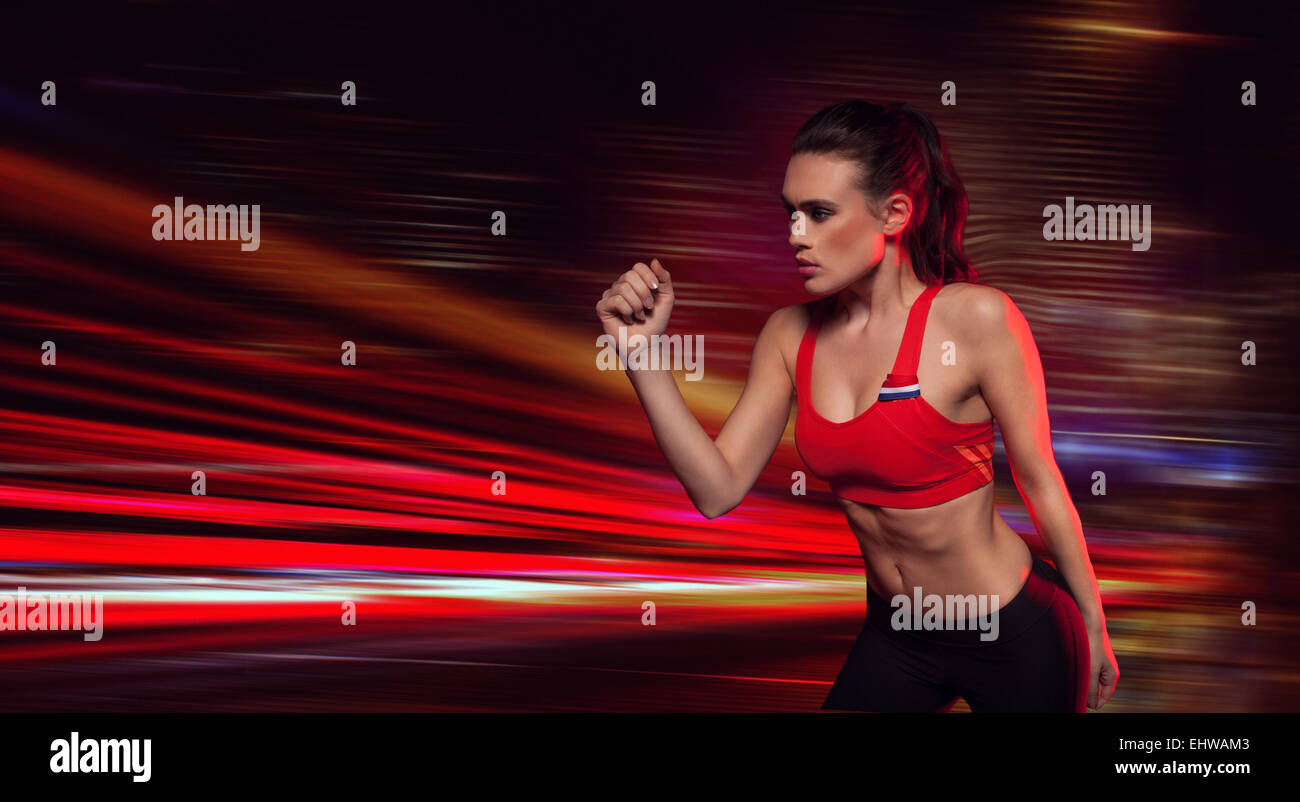 Strong determined female athlete Stock Photo