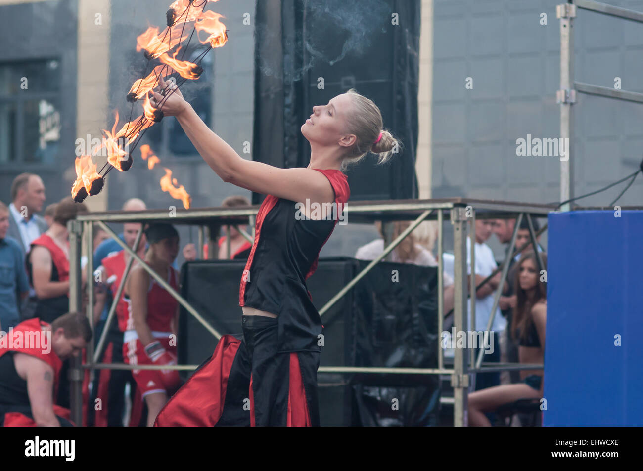 Orenburg, Orenburg region, Russia - 25.07.2014: The girls performed a dance with burning torches during youth meetings in the bo Stock Photo
