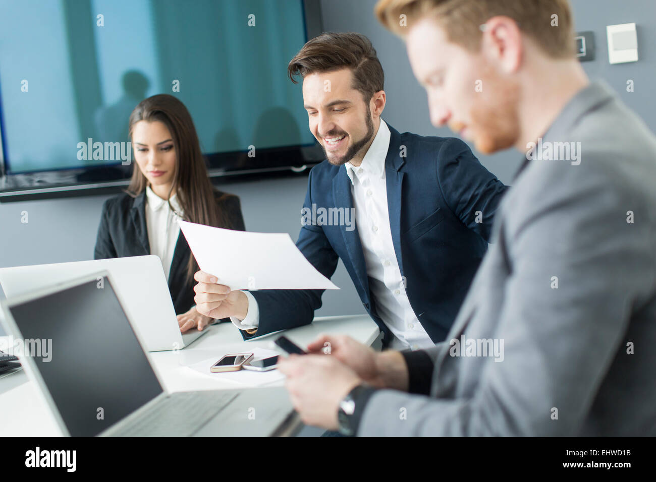 Young people working in the office Stock Photo - Alamy