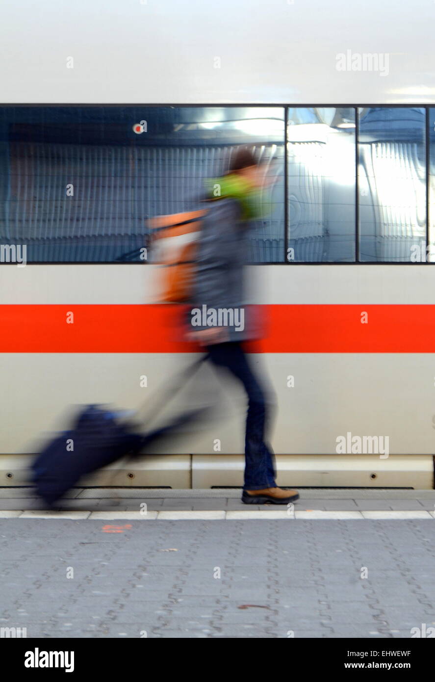 Travel Image Of A Motion Blurred Student Rushing To Catch A Train Stock Photo