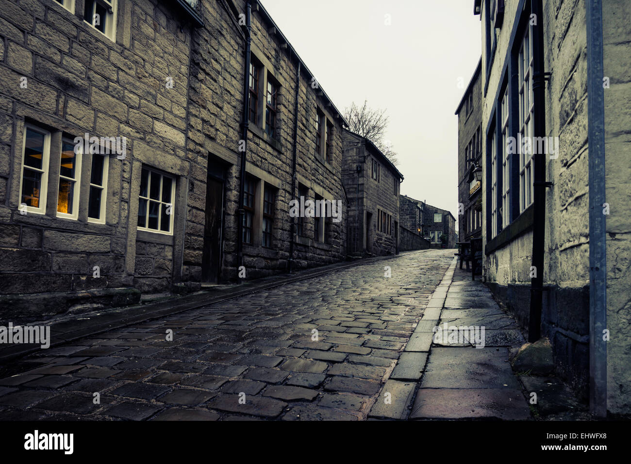 Houses on Town Gate cobbled street in Heptonstall, Yorkshire England on a wet winter day. December 2014 Stock Photo