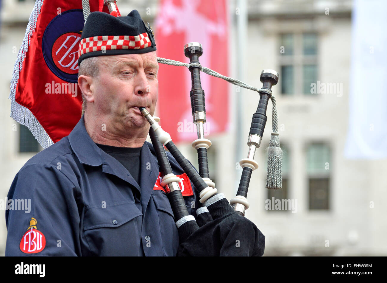 Man playing the bagpipes. London, 25th Feb, 2015, in support of striking firefighters Stock Photo