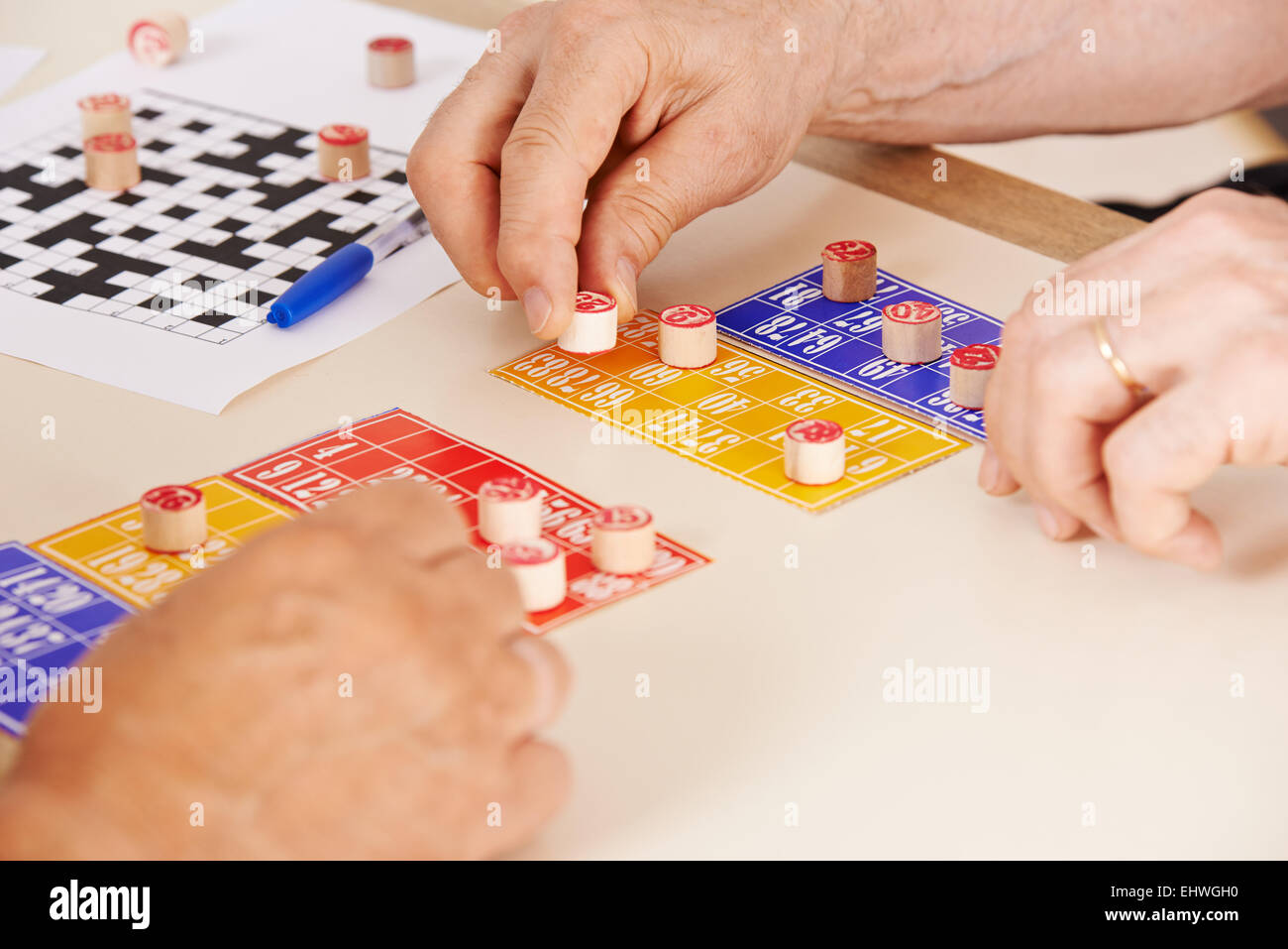 Hands of senior people playing Bingo together in a nursing home Stock Photo