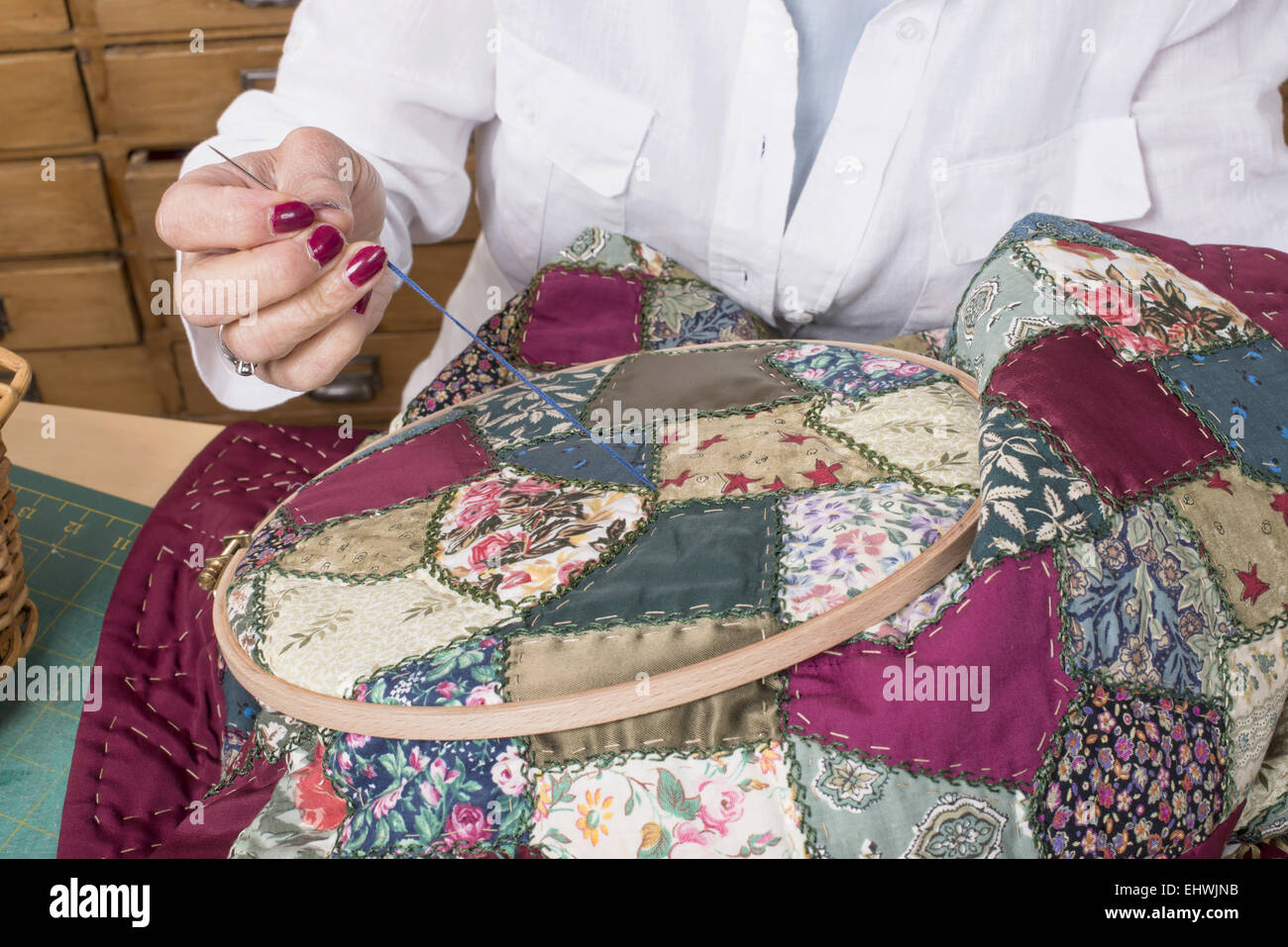 Mature woman by sewing and quilting in her home Stock Photo - Alamy
