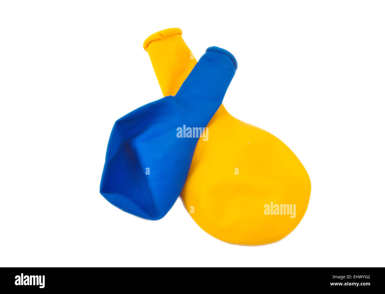 Deflated blue and yellos ballons on white background Stock Photo