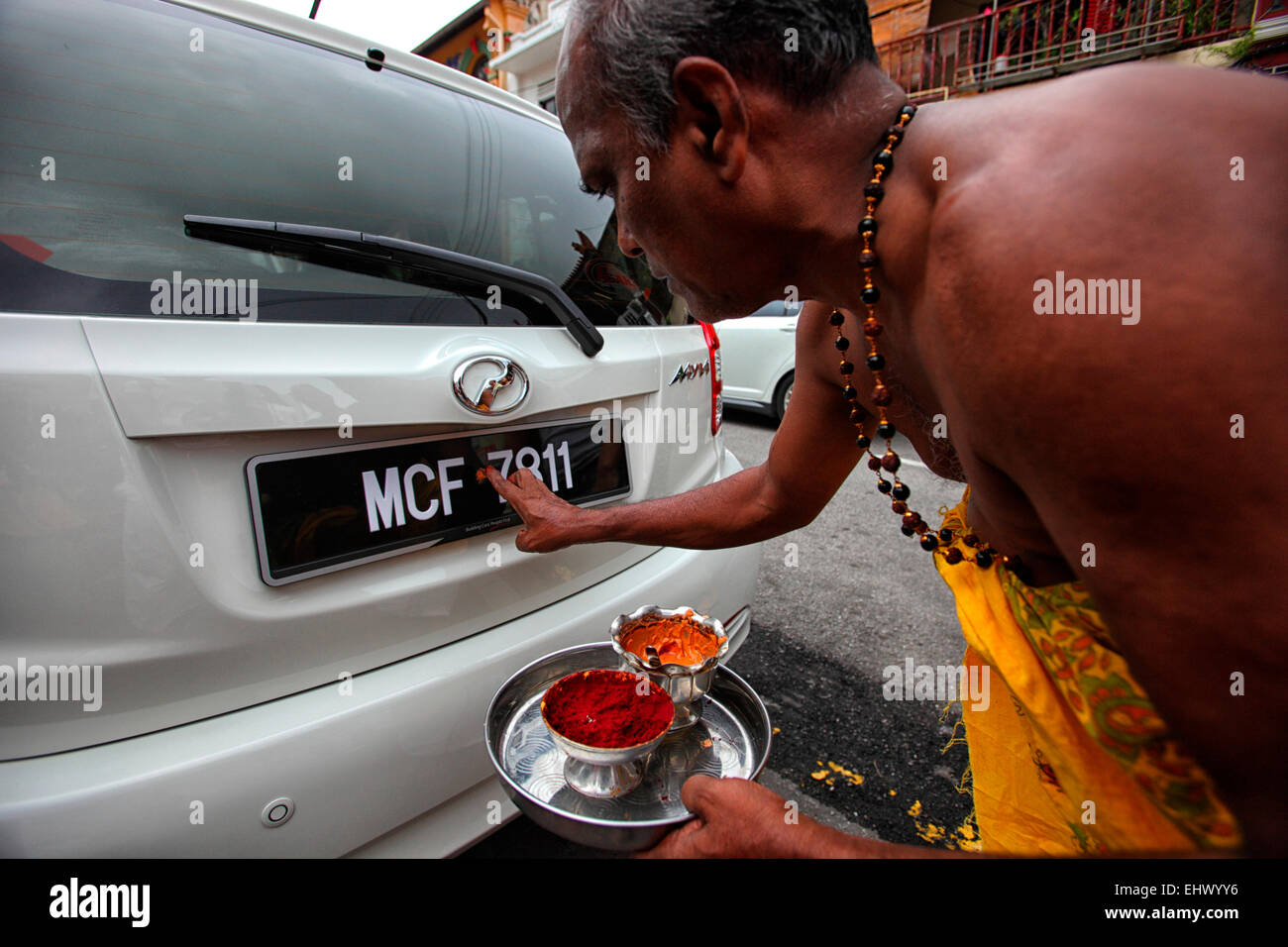 Malaysia, monk blessing new car Stock Photo