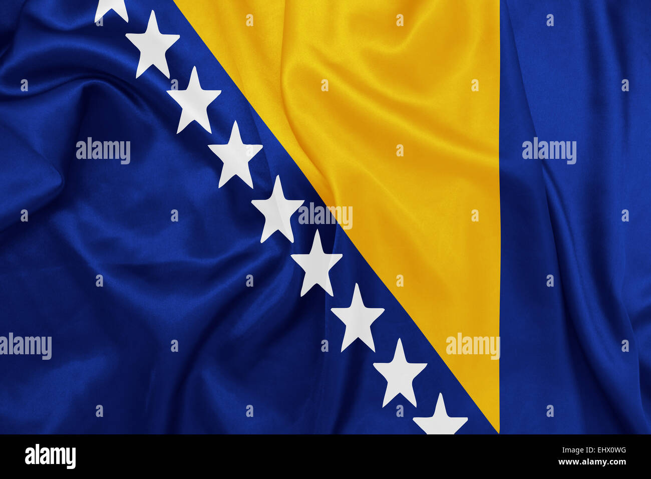 Bosnia and Herzegovina - Waving national flag on silk texture Stock Photo