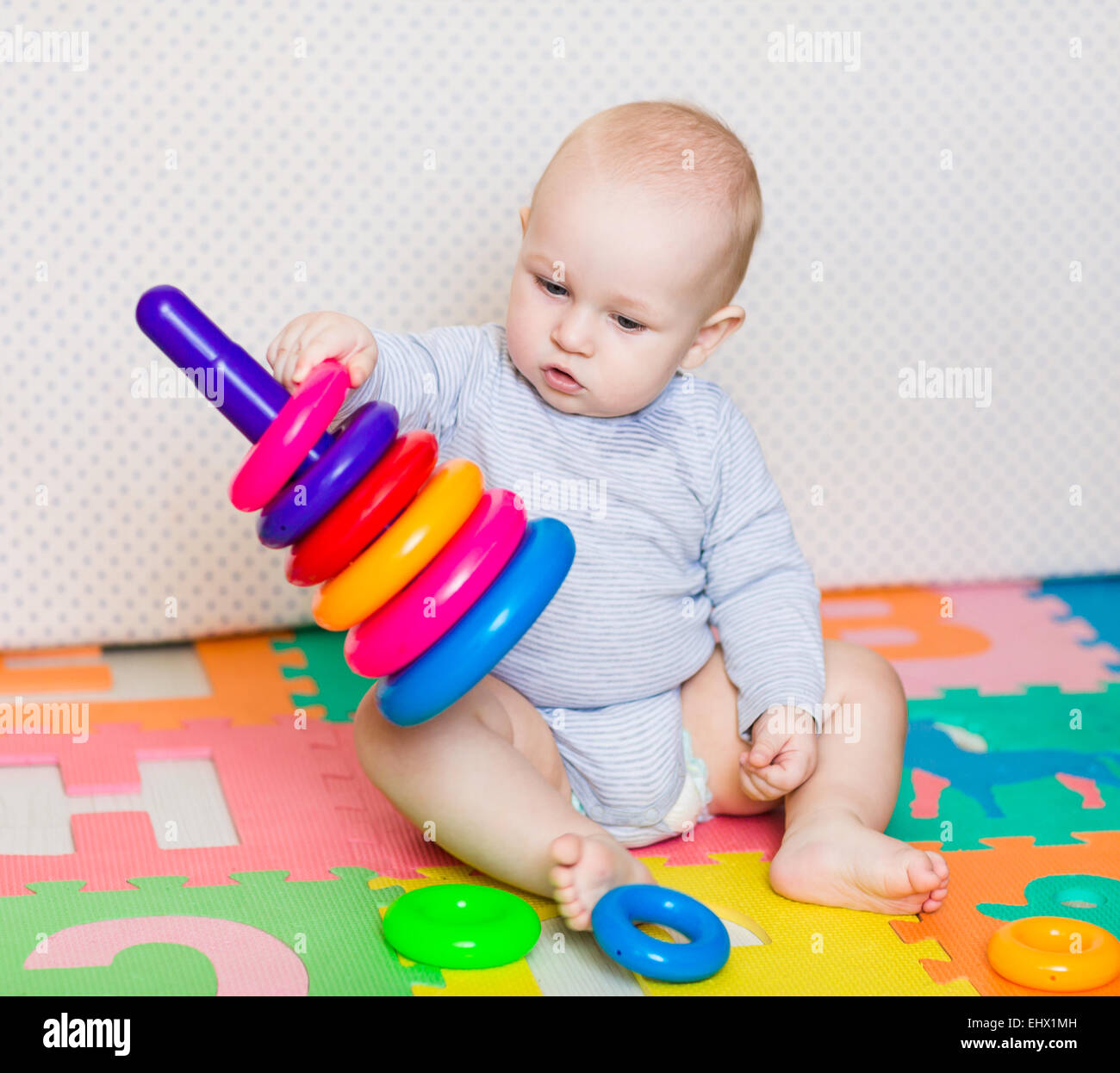 little baby playing with toys
