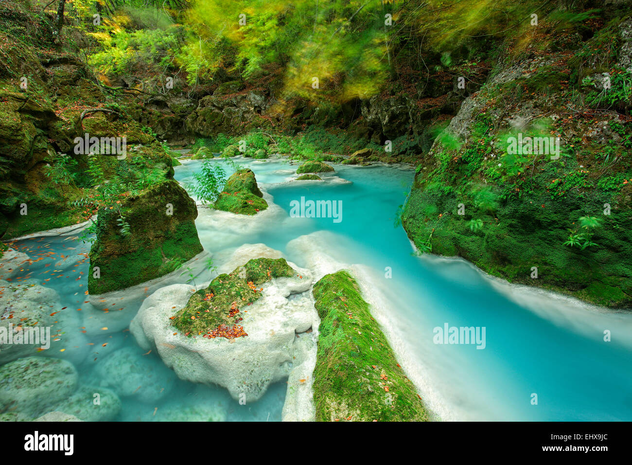 Spain, Urbasa y Andia Natural Park, Urederra river flowing between ...