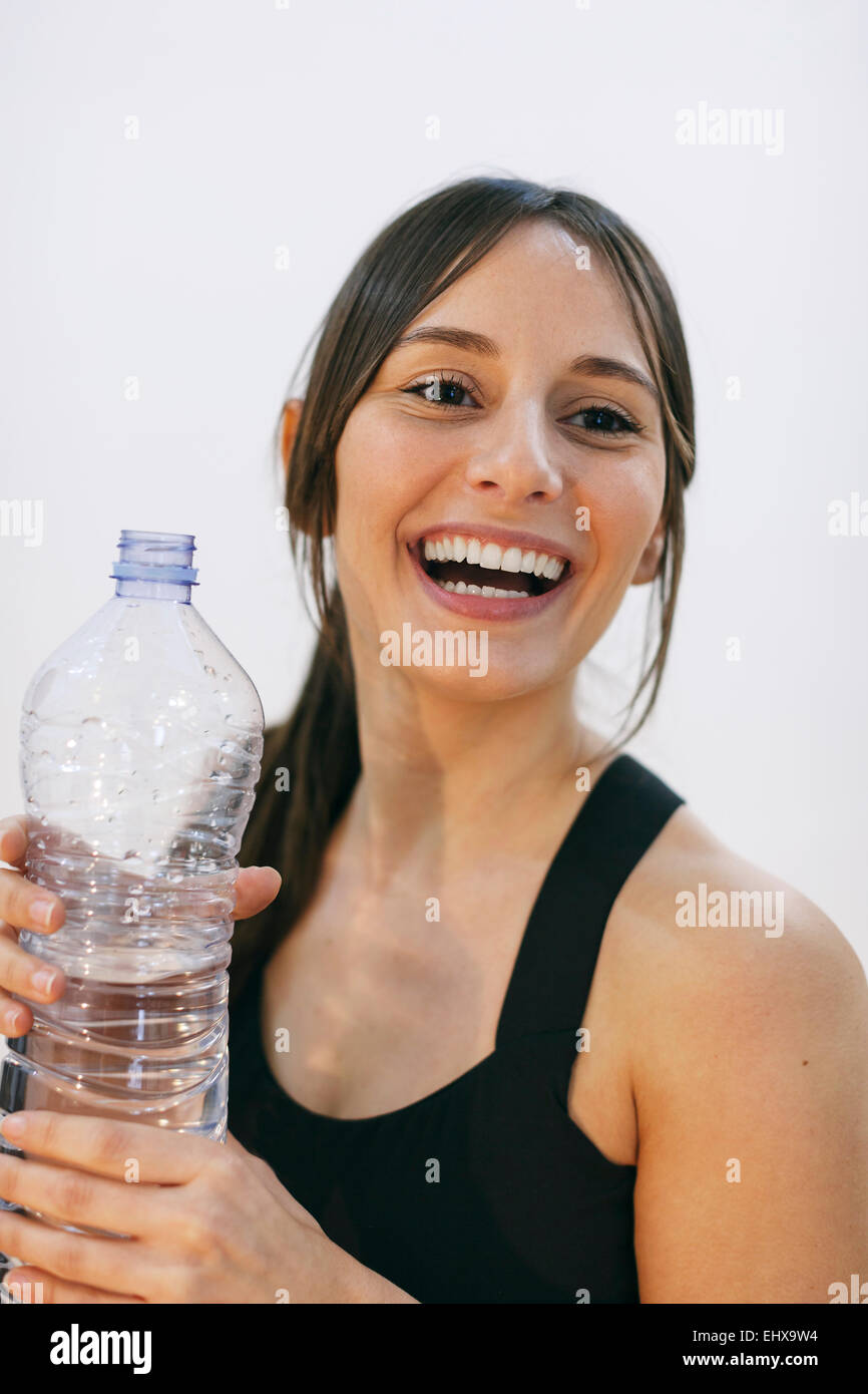 Portrait of laughing woman with water bottle Stock Photo Alamy