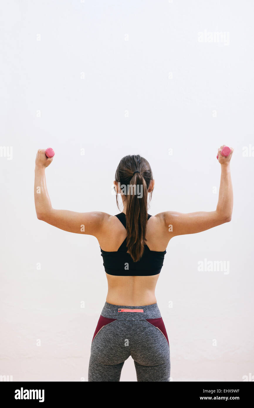 Woman doing strength training with dumbbells Stock Photo Alamy