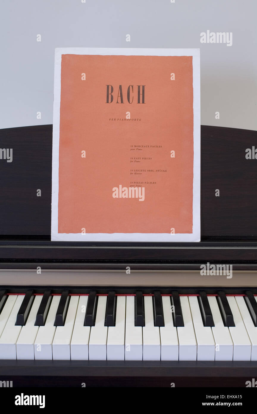Piano keyboard with Bach score Stock Photo