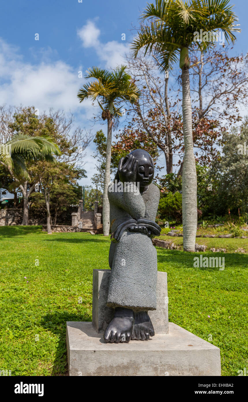 The statue 'Student' is by the Zimbabwean sculptor Jonothan Mhondorohuma in the Queen Elizabeth Park in Hamilton,Bermuda. Stock Photo