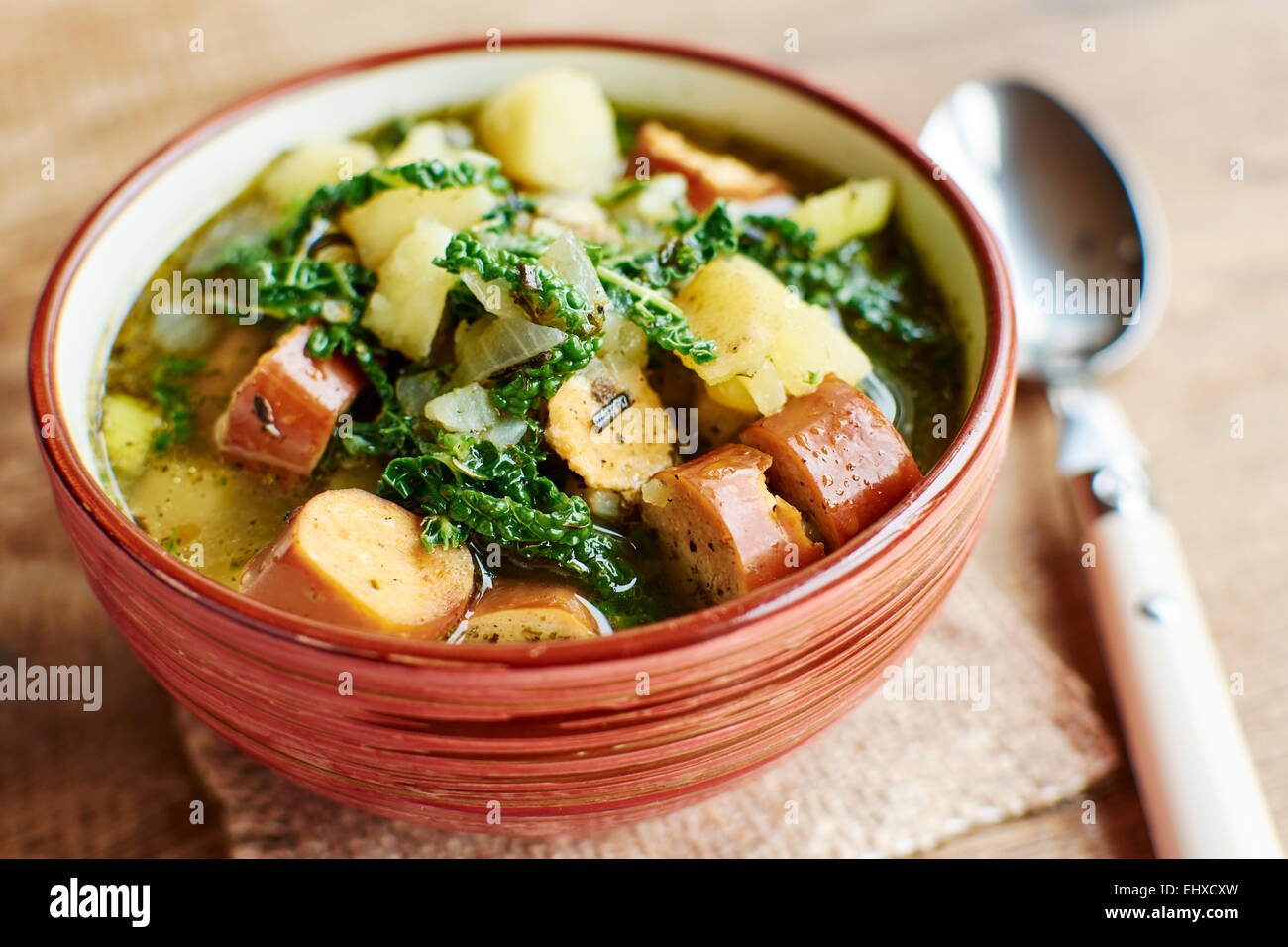 Portuguese Caldo Verde with potatoes, savoy cabbage and vegan sausages Stock Photo