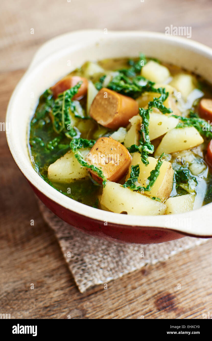 Portuguese Caldo Verde with potatoes, savoy cabbage and vegan sausages Stock Photo