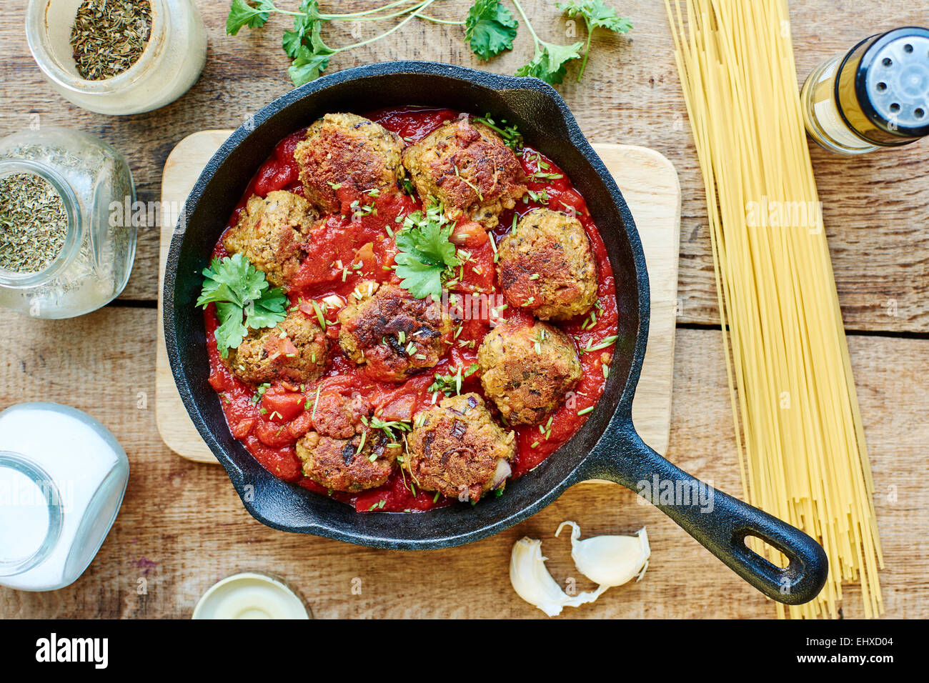 Vegan meatless balls in tomato sauce in a cast iron pan Stock Photo Alamy
