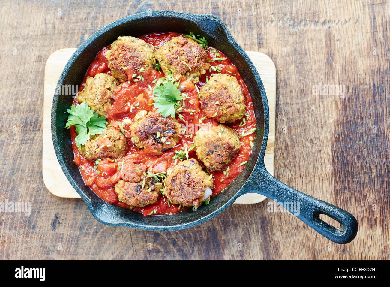 Vegan meatless balls in tomato sauce in a cast iron pan Stock Photo Alamy
