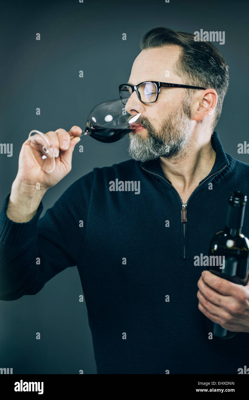 Man tasting red wine Stock Photo - Alamy