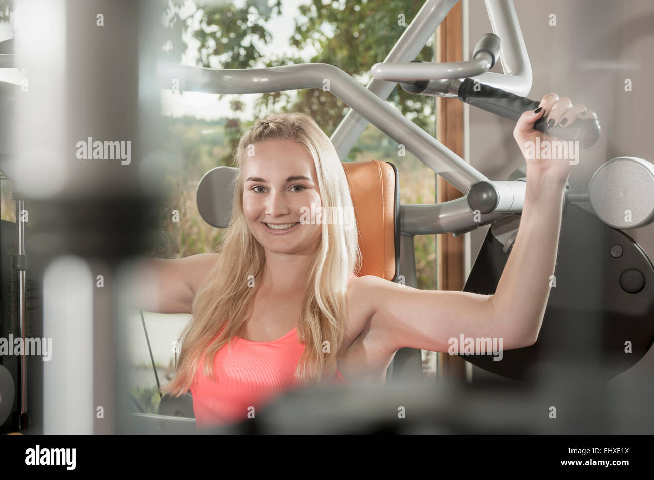 Attractive smiling blond woman fitness studio Stock Photo - Alamy
