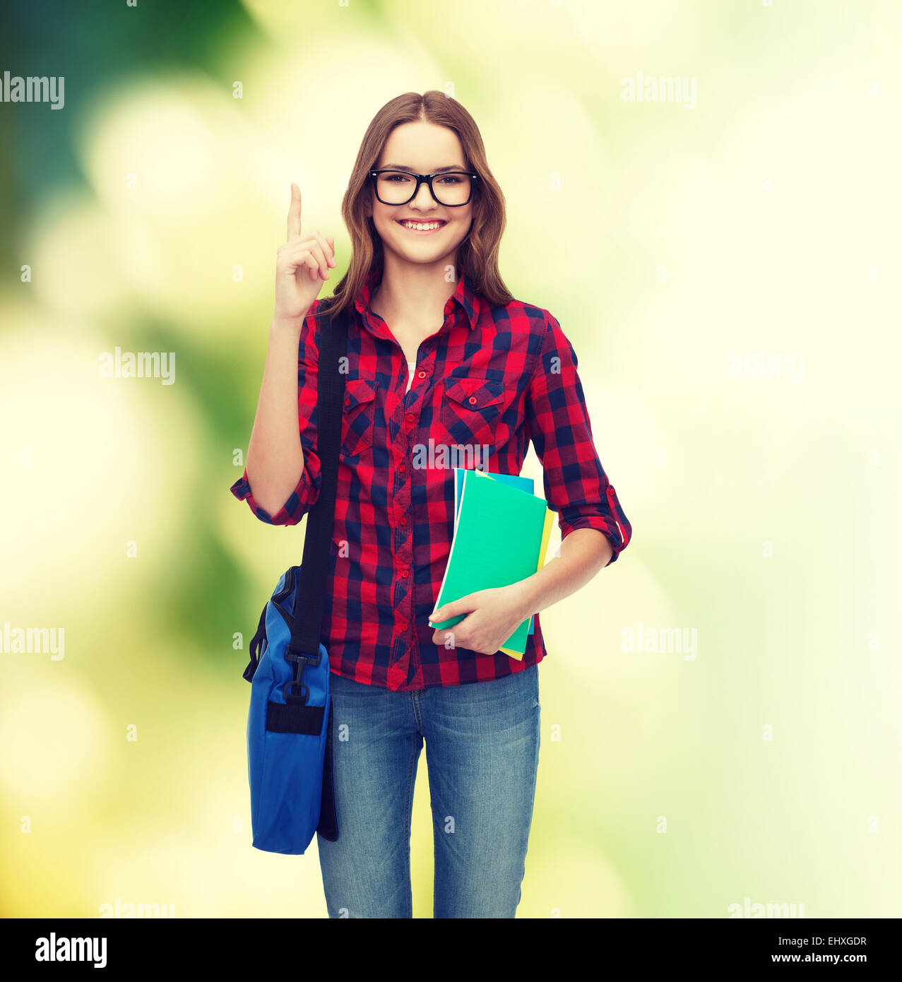 smiling female student with bag and notebooks Stock Photo - Alamy