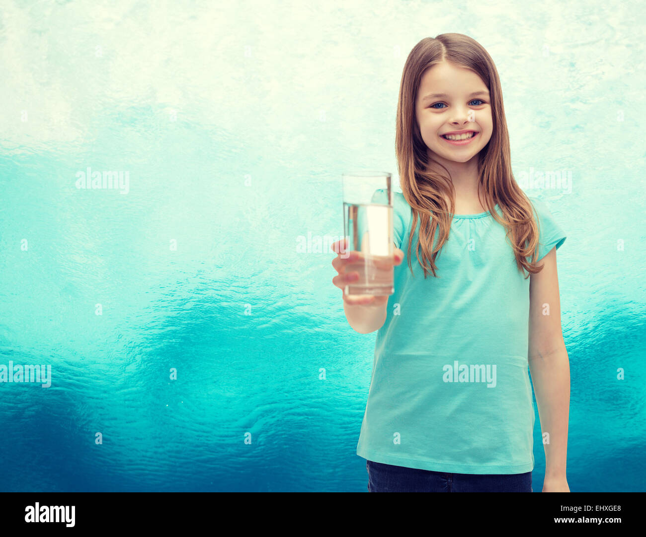 smiling little girl giving glass of water Stock Photo - Alamy