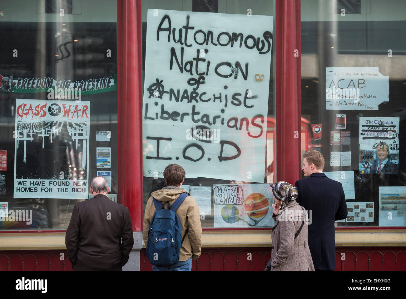 London, UK. 18th Mar, 2015. Squatters occupy an empty building next to the Institute of Directors in Pall Mall. They are anti capitalist and are raising concerns about the London housing crisis on Budget Day. The mix of occupants include anti-frackers and anarchists. Credit:  Guy Bell/Alamy Live News Stock Photo